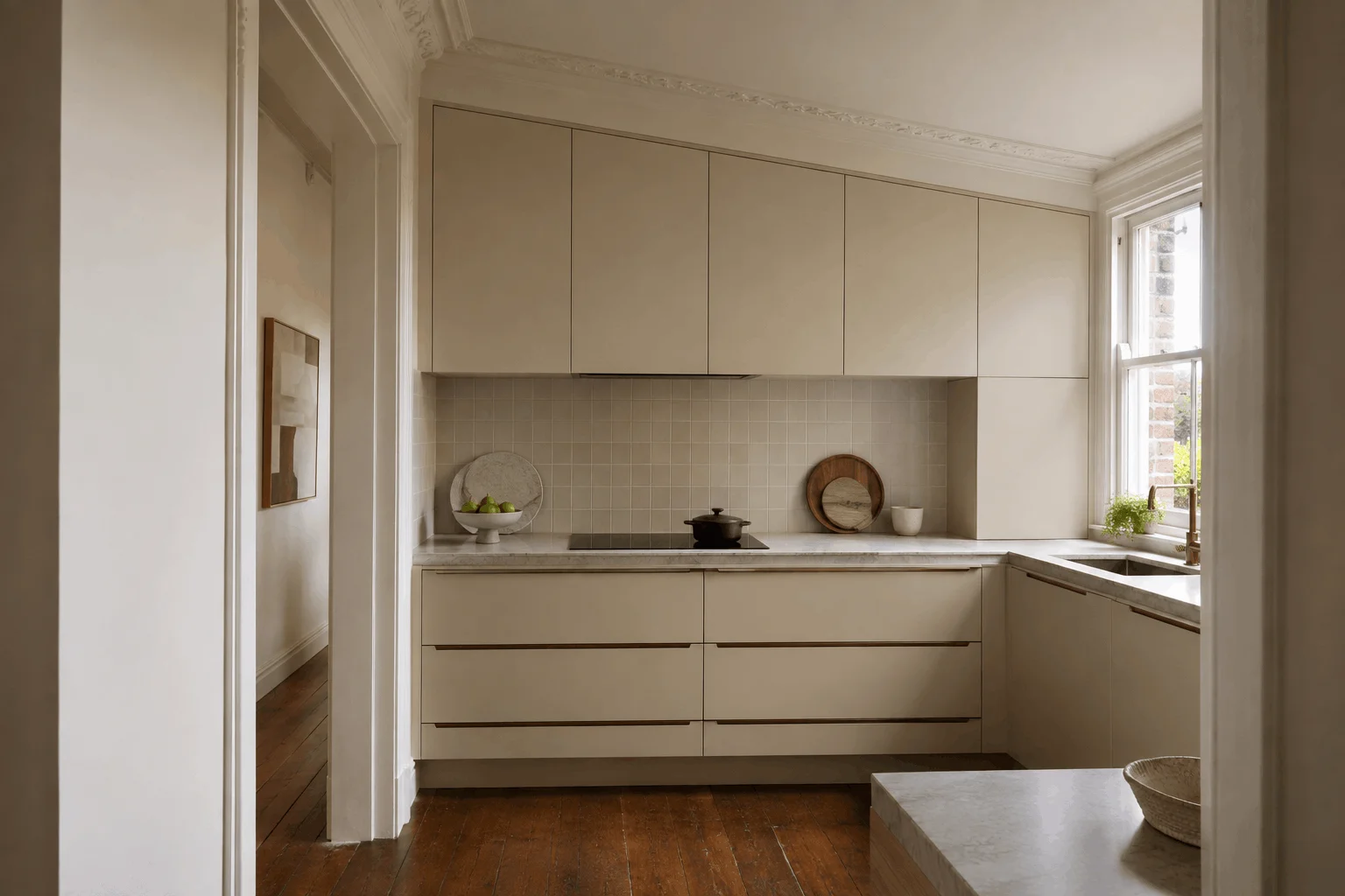 Illustrative custom kitchen joinery fitted within an older home with retained cornices and timber flooring